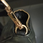 Axel triangle bag like new, dark green with gold details