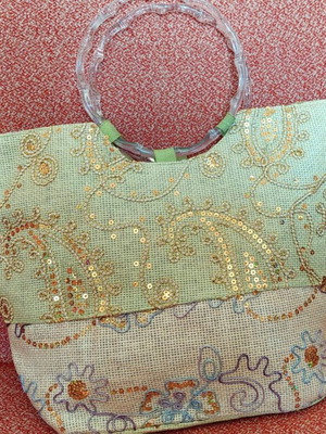 Summer handbag with gold sequin embroidery and round handle