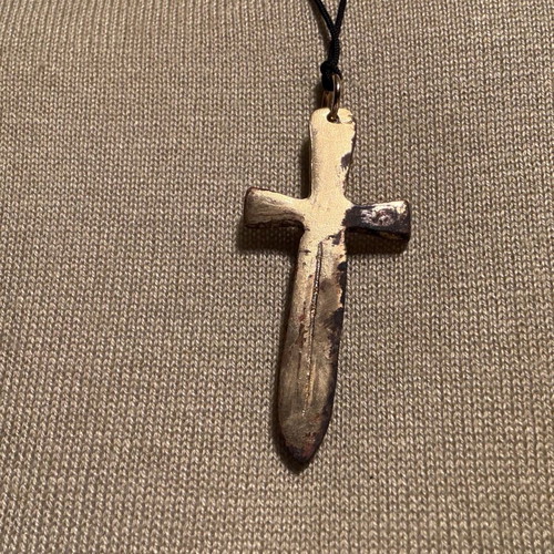 Sword-shaped pendant like new with red stone and leather cord