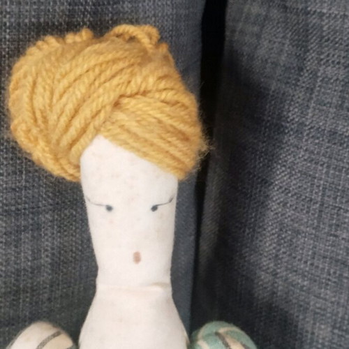 Handmade doll used with fabrics and detailed design