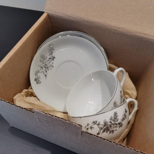 Tea cup set used with silver design, set of two
