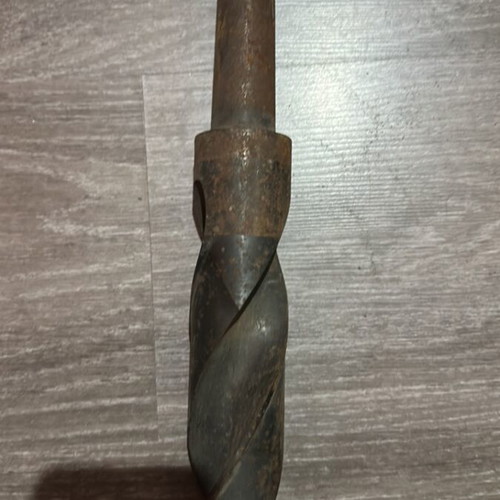 Large metal twist drill bit used with Morse taper shank