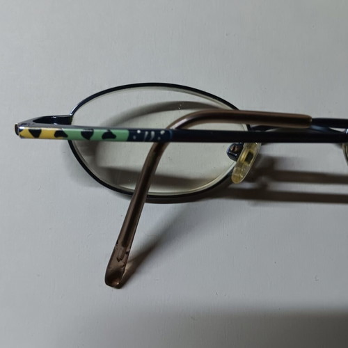 Oval children's eyeglasses used with black case