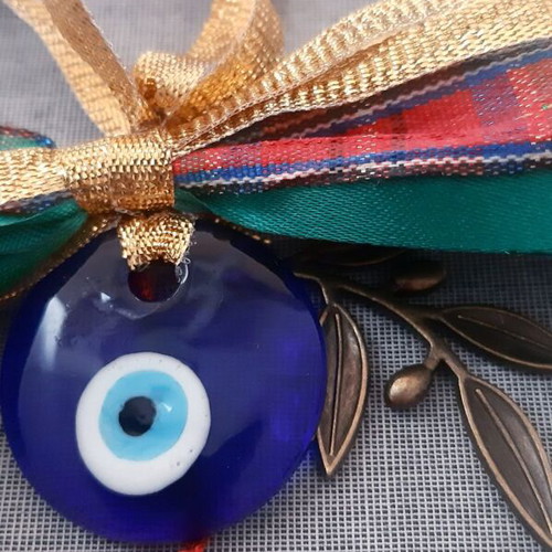 Glass eye charm with bronze olive branch and silk tassel, handmade