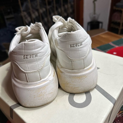 Seven white athletic shoes used, size 37