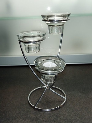 Decorative metal candle holder with three tealight positions used
