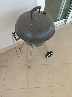 Grill with tongs used