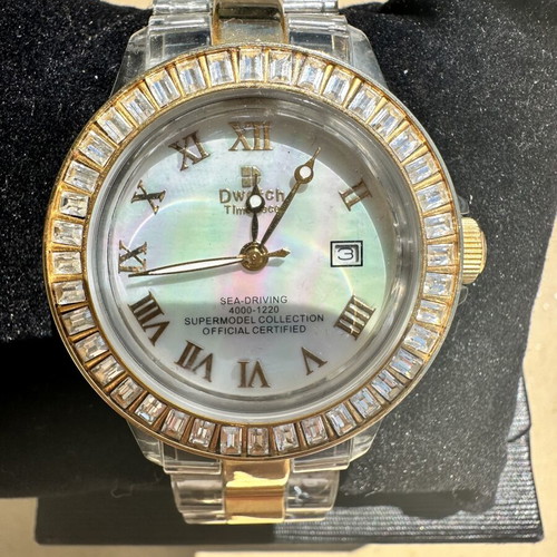 Watch with iridescent crystals like new, zircon and gold