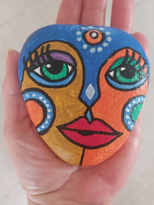 Painted stone new with African mask and acrylic colors