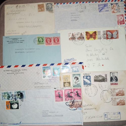 Collection of envelopes and stamps from around the world, new