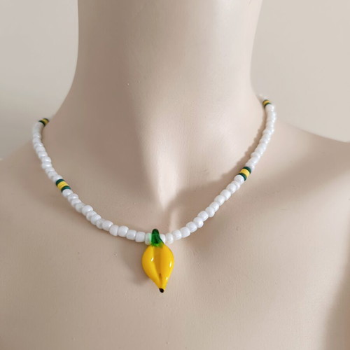 Handmade white short necklace with glass banana pendant