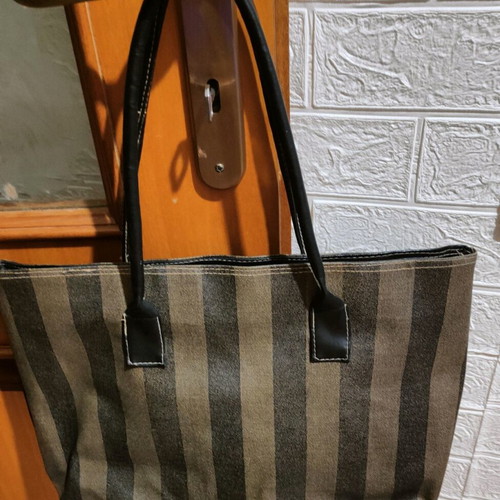 Handbag used with beige-brown stripes, plastic fabric