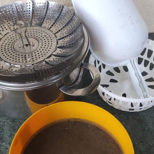 Cookware set used with pot, steamer, sieve, and colander