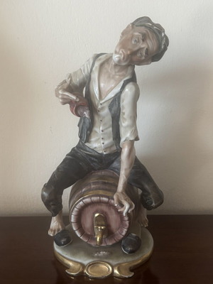 Porcelain figurine used, vintage style Capodimonte drunk man on barrel