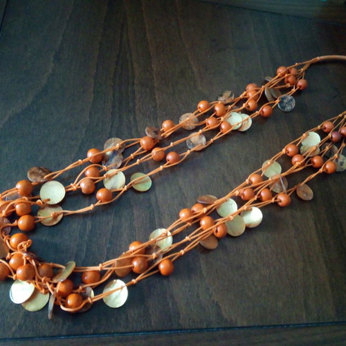 Alternative summer necklace used with wooden beads and orange mother of pearl