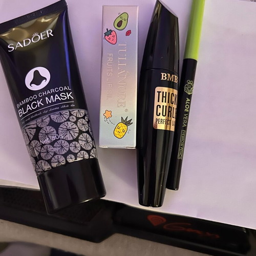 Cosmetics set new with black mask, lip oil, eyebrow pencil, mascara