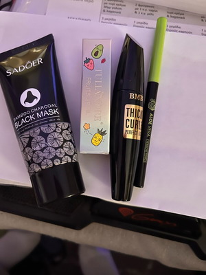Cosmetics set new with black mask, lip oil, eyebrow pencil, mascara