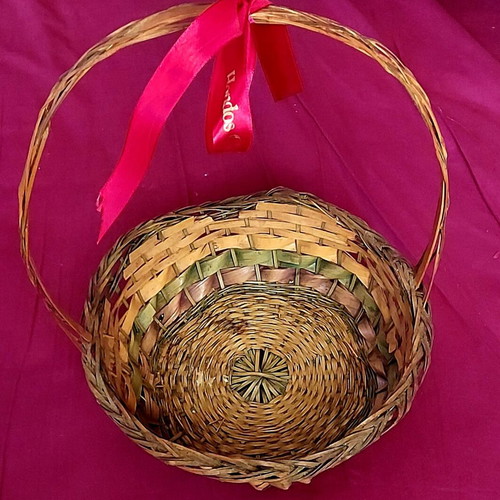Wicker Easter basket used with red ribbon