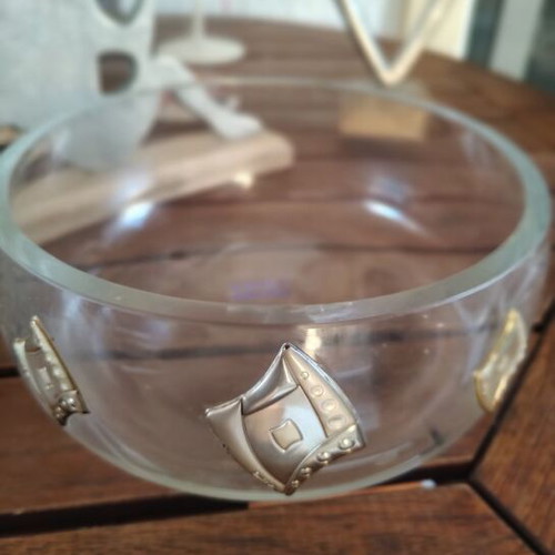Crystal bowl with silver details and glass serving platter used for nuts