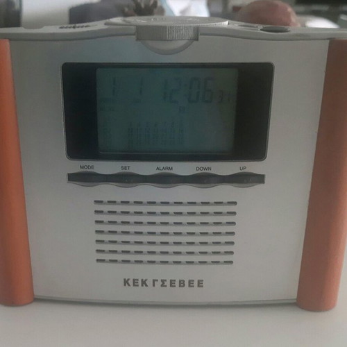 Retro digital tabletop clock with day, month, and year display