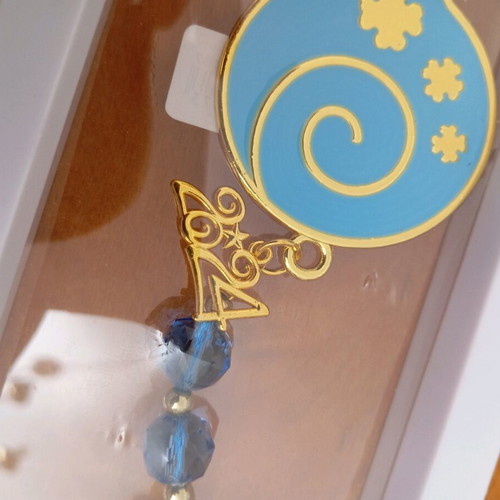 Decorative hanging like new with blue tassel and metal pomegranate