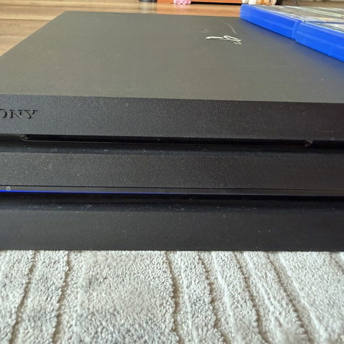 PlayStation 4 Pro 1TB console used with 2 original controllers and games