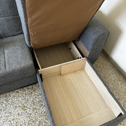 Corner sofa bed with storage compartments