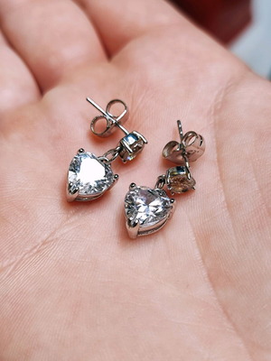 Silver earrings used with white stones