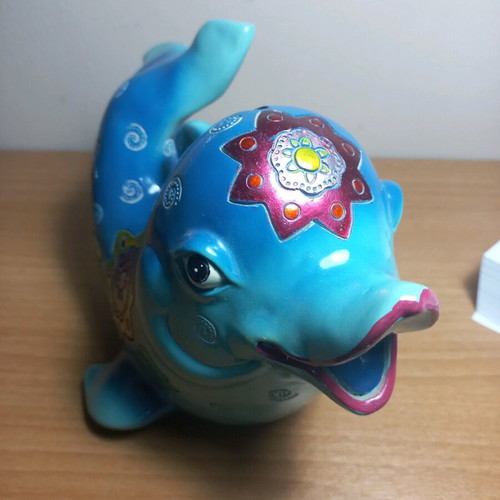 Dolphin piggy bank with designs like new