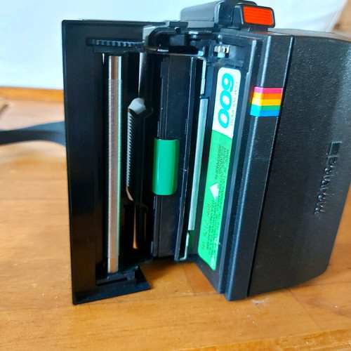 Polaroid Supercolor 635CL vintage instant camera used with strap