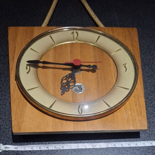 Mid-Century Modern wall clock like new with rope and wood
