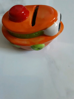 Small boat-shaped piggy bank like new