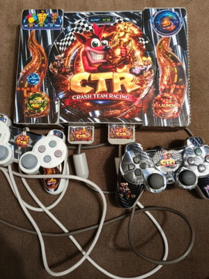 PlayStation PS1 console with Crash Team Racing theme
