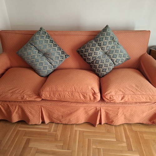 Vintage three-seater sofa and two antique armchairs with dark wood frame