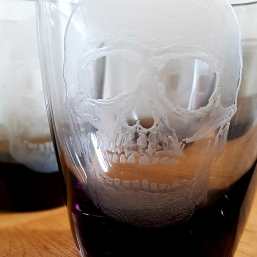 Collectible whiskey and vodka glasses, pack of 5, new with engraved skull