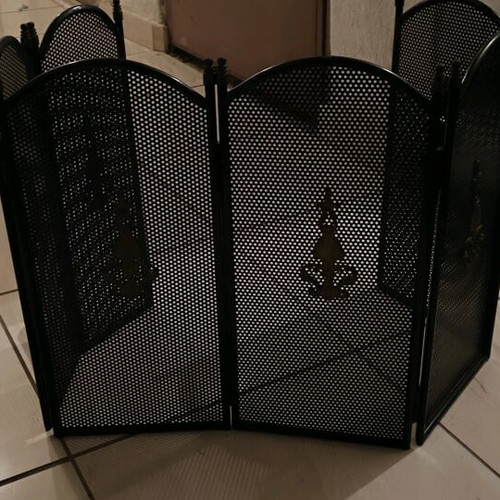 Bronze fireplace cover like new with gold details