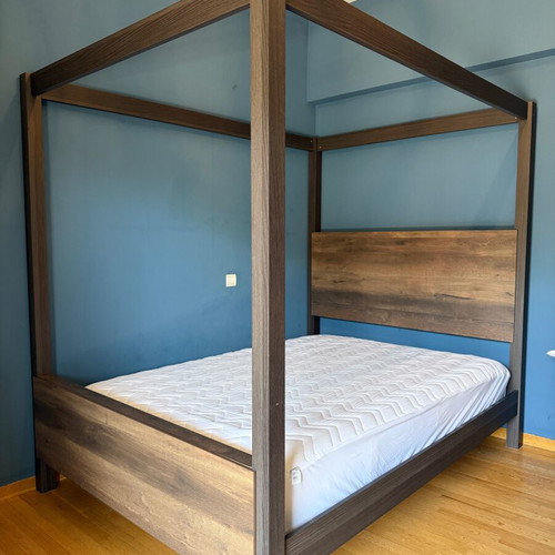 Bedroom furniture set with canopy bed, dresser, mirror, and nightstand
