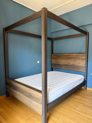 Bedroom furniture set with canopy bed, dresser, mirror, and nightstand