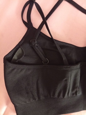 Sports top with chest padding and adjustable cross straps, new, size M-L