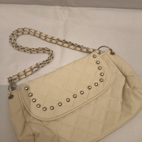 Women's shoulder bag like new, milky color with silver details