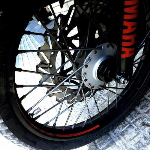 Complete motorcycle wheels with tires, disc and drum brakes