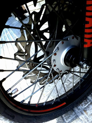 Complete motorcycle wheels with tires, disc and drum brakes