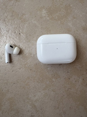Apple AirPods Pro 2 left earbud with genuine lightning charging case