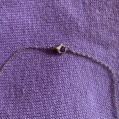 Family necklace made of steel like new with silver eye charm