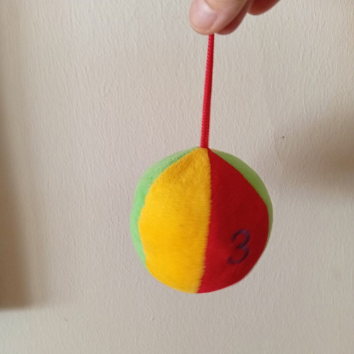 Hanging fabric ball toy