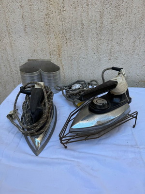 Old irons with stand used, set of two pieces