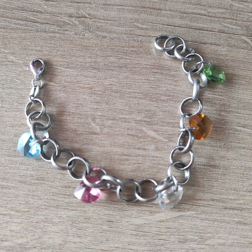 Silver 925 bracelet like new with multicolored dangling zircon hearts