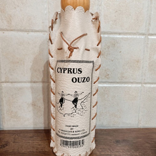 Decorative Cyprus Ouzo bottle cover with wooden lid like new