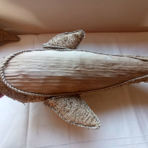 Handmade decorative dolphin made of grass
