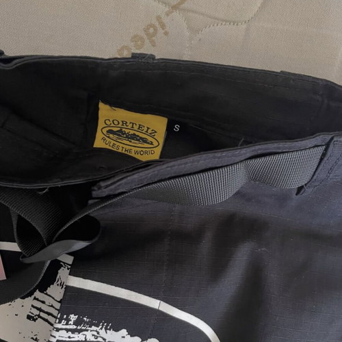 Corteiz cargo shorts, black and white, streetwear style